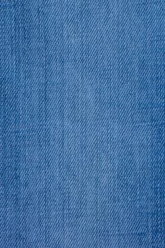 Jeans material with a rough texture blue color. Stock Photos