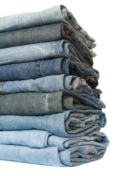 Jeans pile over white, soft focus Stock Photos