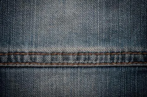 Jeans texture with seam. Stockfoto's