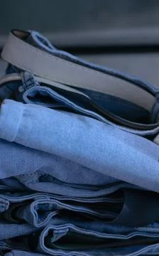 Jeans trousers stack closeup Stock Photos