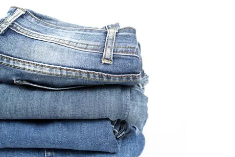 Jeans trousers stack on white background Foto stock