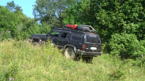 The jeep arrives from the mountain Stock Footage 137347971