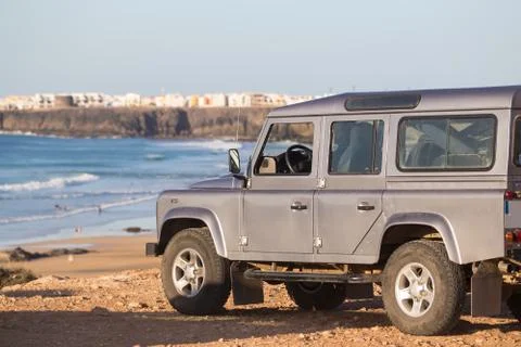 Jeep on beach. Stock Photos