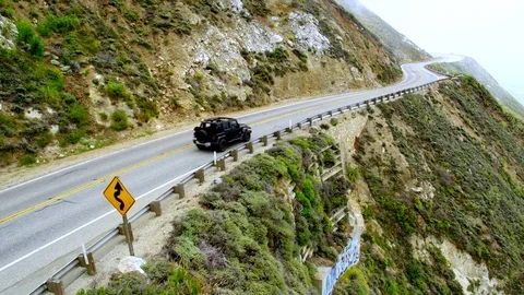 Jeep on Cliffside Highway in Big Sur by Aerial Drone Stock Footage 80963983