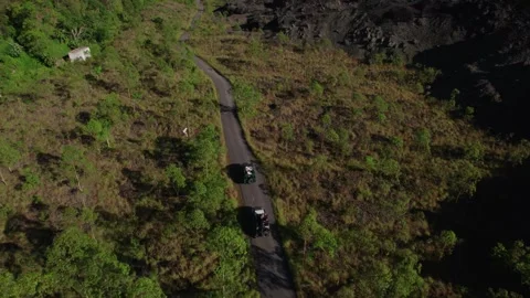 Jeep Convoy Driving to Lava Fields at Mount Batur, Bali – Aerial View Stock Footage 313874681