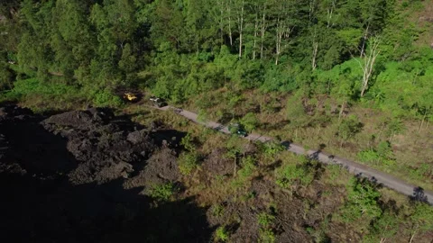 Jeep Convoy Driving to Lava Fields at Mount Batur, Bali – Aerial View Stock Footage 313874784
