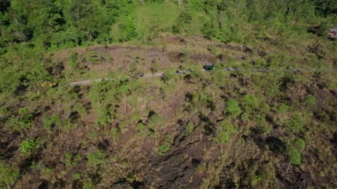 Jeep Convoy Driving to Lava Fields at Mount Batur, Bali – Aerial View Stock Footage 313874788