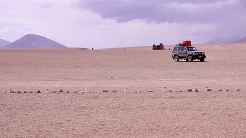A jeep crossing the desert Stock Footage 87035616