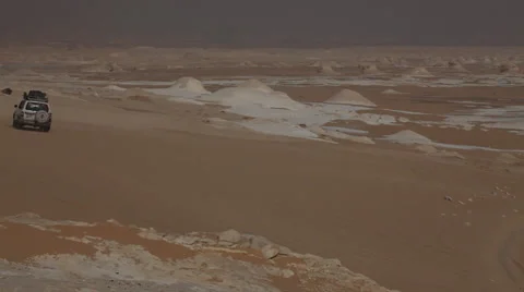 Jeep crossing the White Desert, Egypt Stock Footage 36117480