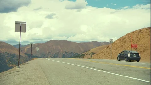 A Jeep drives down a mountain Stock Footage 94837168