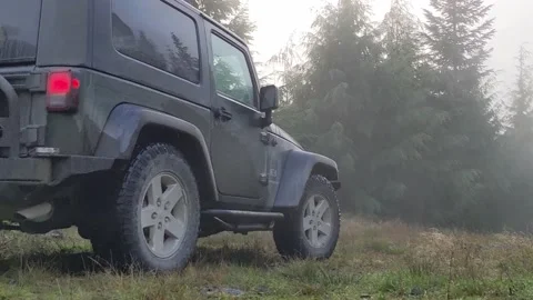 Jeep driving down grassy path Stock Footage 172563542