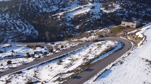 Jeep driving down a mountain in winter Stock Footage 158547856