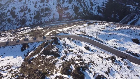 Jeep driving down a mountain in winter Stock Footage 158547859