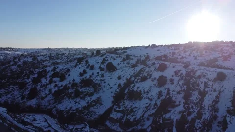 Jeep driving down a mountain in winter Stock Footage 158547873