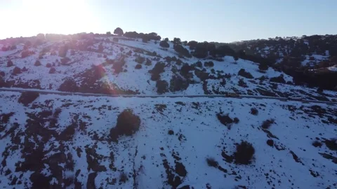 Jeep driving down a mountain in winter Stock Footage 158547875