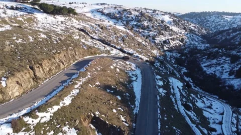 Jeep driving down a mountain in winter Stock Footage 158547887