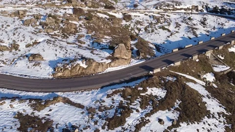 Jeep driving down a mountain in winter Stock Footage 158547895