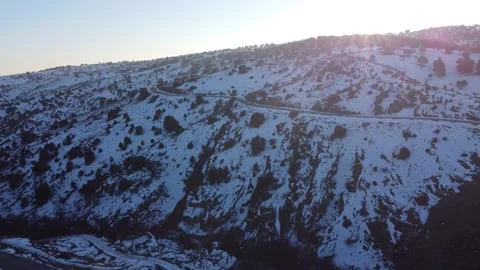 Jeep driving down a mountain in winter Stock Footage 158547911