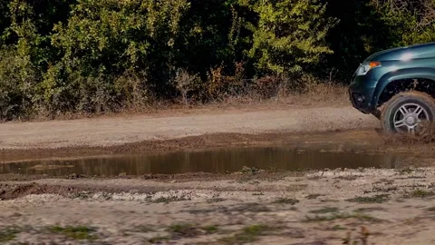 The jeep is driving at full speed through the mud! Stock Footage 165100387