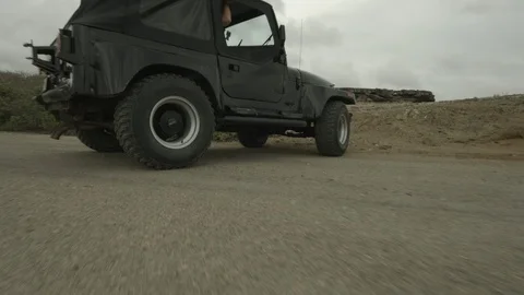 Jeep Driving on rough terrain Stock Footage 87705259