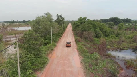 Jeep driving on a small path in asia with jungle Stock Footage 158740317