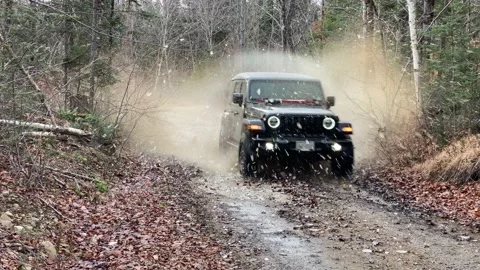 Jeep driving through ice puddle Stock Footage 168583096