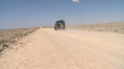 Jeep on dusty road Stock Footage 8540832