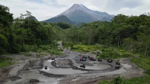 Jeep Lava Tour with the Background of Mount Merapi, Yogyakarta Stock Footage 247332792