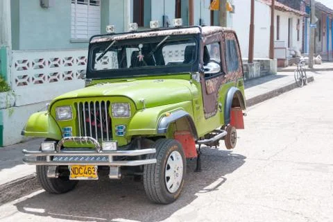 Jeep with missing wheel in Baracoa Stock Photos
