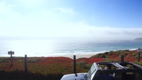 Jeep parking off PCH in Big Sur by Aerial Drone Stock Footage 80963861