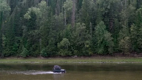 Jeep rides the river. Mountain. Forest. Ural Stock Footage 74092596