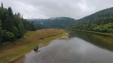 Jeep rides the river. Mountain. Forest. Ural. Video stock 87036831