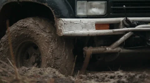 Jeep rides through the mud in the woods 3 Stock Footage 23836672
