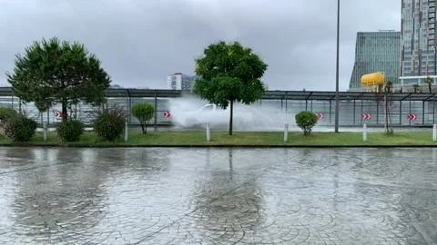 Jeep rides through a puddle in the rain Stock Footage 162223032