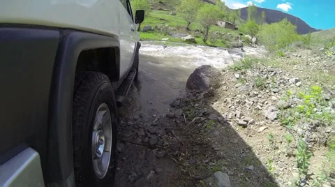 Jeep rides through the river (slow motion) Stock Footage 38103409