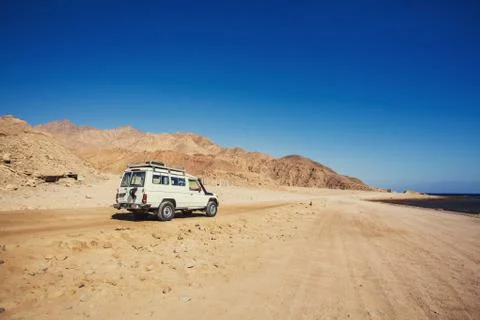 Jeep off road in a mountain desert Stock Photos