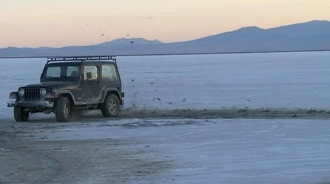 Jeep off roading at Salt Flats in slow motion Stock Footage 8677331