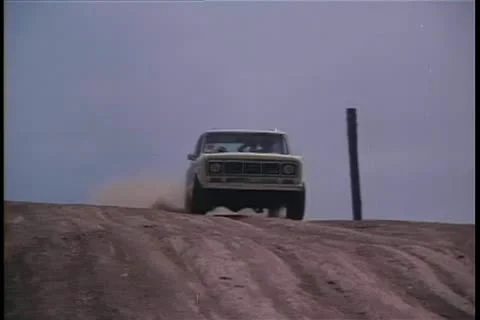 Jeep speeding down dirt road Stock Footage 11349895