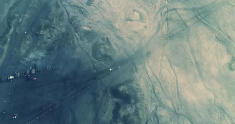Jeeps moving below think mist in Mount Bromo an aerial view, Indonesia Stock Footage 93911455