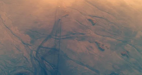 Jeeps moving below think mist in Mount Bromo an aerial view, Indonesia Stock Footage 93911737