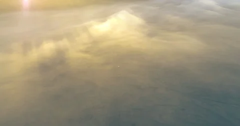 Jeeps moving below think mist in Mount Bromo an aerial view, Indonesia Stock Footage 93911907