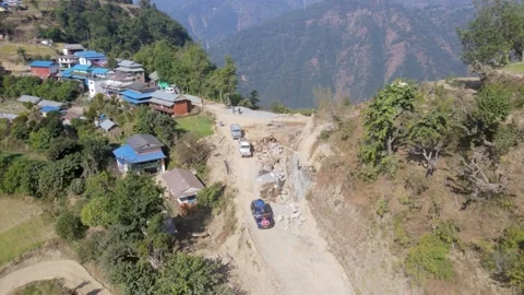 Jeeps running in the mountain road in Nepal, aerial drone video Video stock 155367016