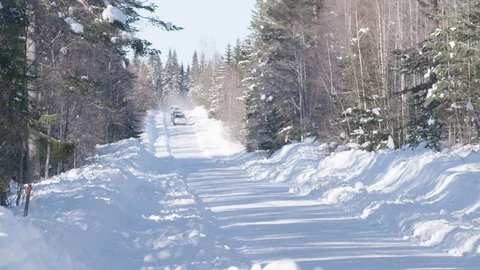 Jeeps with trailers driving on a snowy forest road, Tackasen, Sweden Stock Footage 104247059