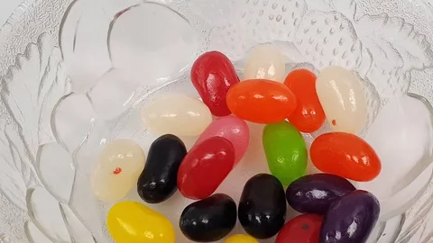 Jelly beans falling into container. Stock Footage 106721428