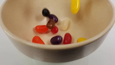 Jelly beans falling into container. Stock Footage 106721429