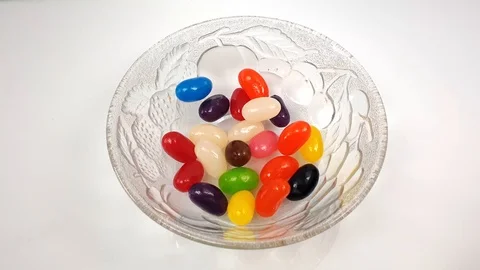 Jelly beans falling into container. Stock Footage 106721452