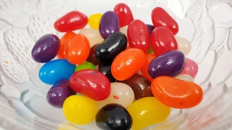 Jelly beans falling into container. Stock Footage 106721504