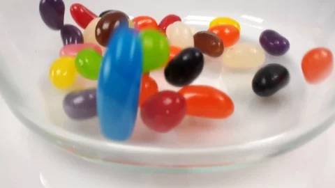 Jelly beans falling into container. Stock Footage 106721508