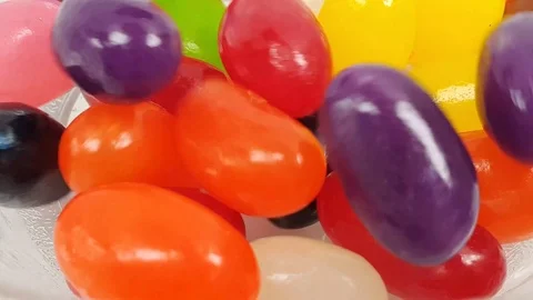 Jelly beans falling into container. Stock Footage 106721512