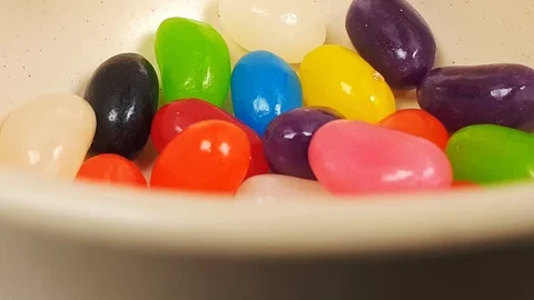 Jelly beans falling into container. Stock Footage 106721551